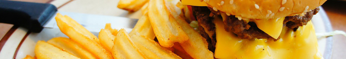 Eating Burger at Grindhouse Killer Burgers restaurant in Athens, GA.